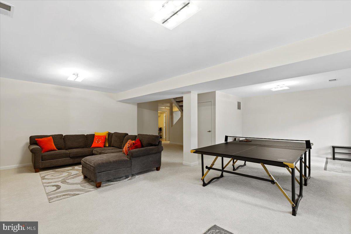 9411 Fernwood Road Bethesda, MD 20817 - Photo 53 of 101 a living room with furniture and a rug