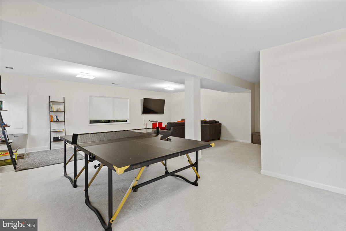 9411 Fernwood Road Bethesda, MD 20817 - Photo 55 of 101 a living room with furniture and flat screen tv
