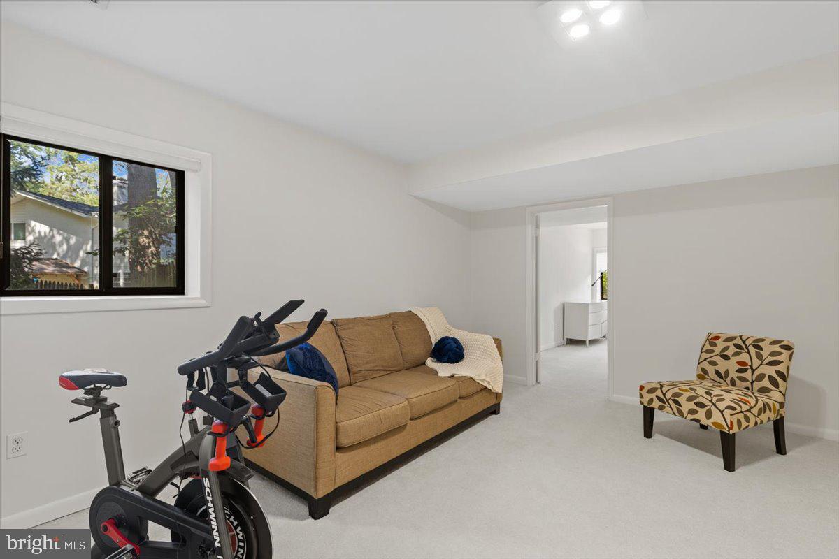 9411 Fernwood Road Bethesda, MD 20817 - Photo 58 of 101 a living room with furniture and a window