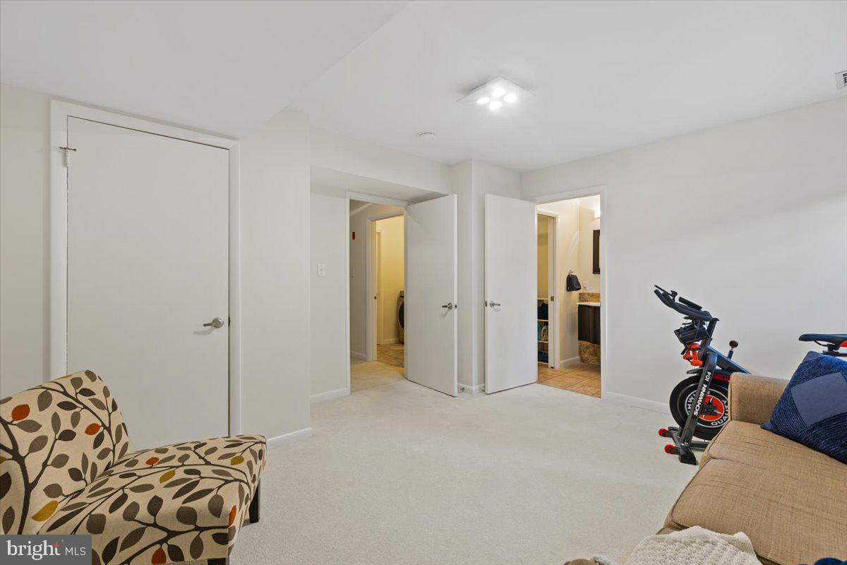 9411 Fernwood Road Bethesda, MD 20817 - Photo 60 of 101 a view of a livingroom with furniture and natural light