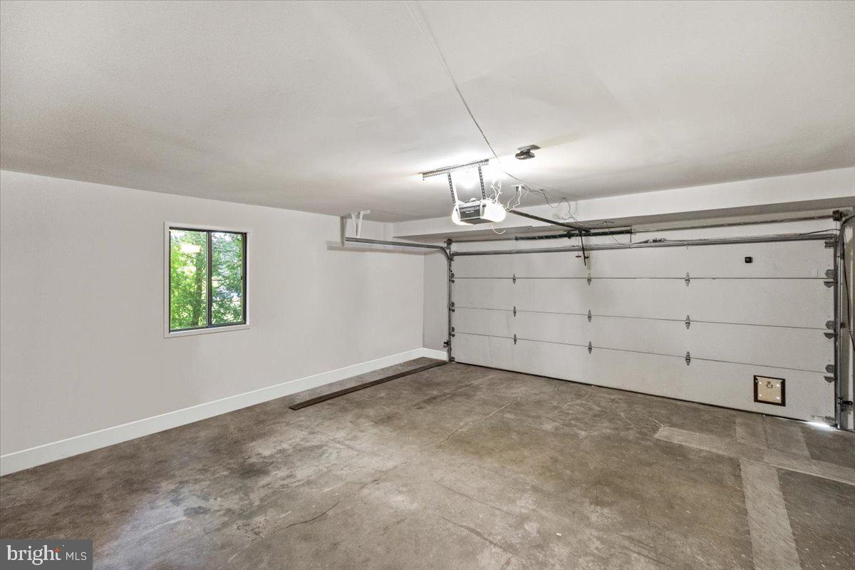 9411 Fernwood Road Bethesda, MD 20817 - Photo 67 of 101 an empty room with chandelier fan