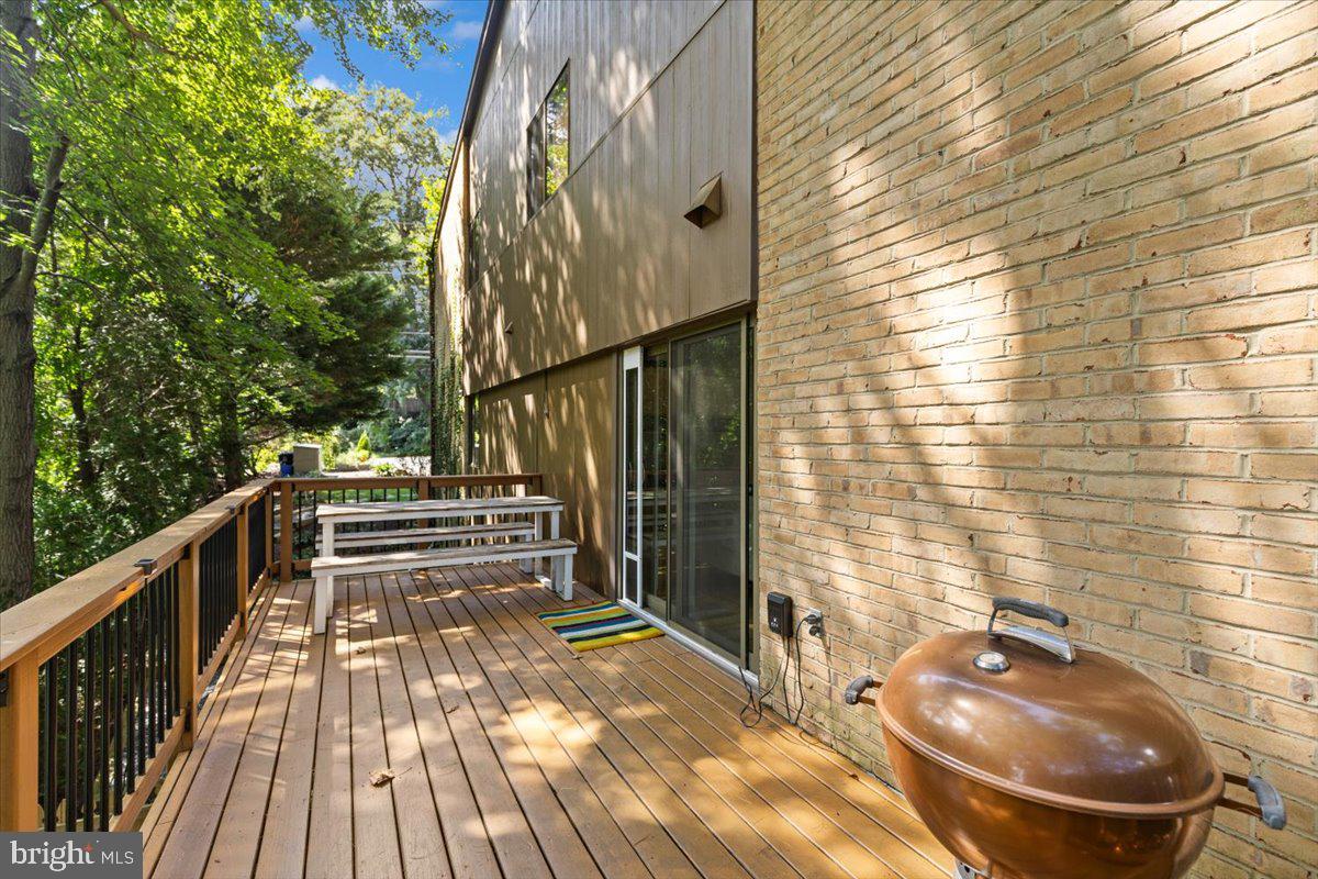 9411 Fernwood Road Bethesda, MD 20817 - Photo 73 of 101 a view of balcony with wooden floor and outdoor seating