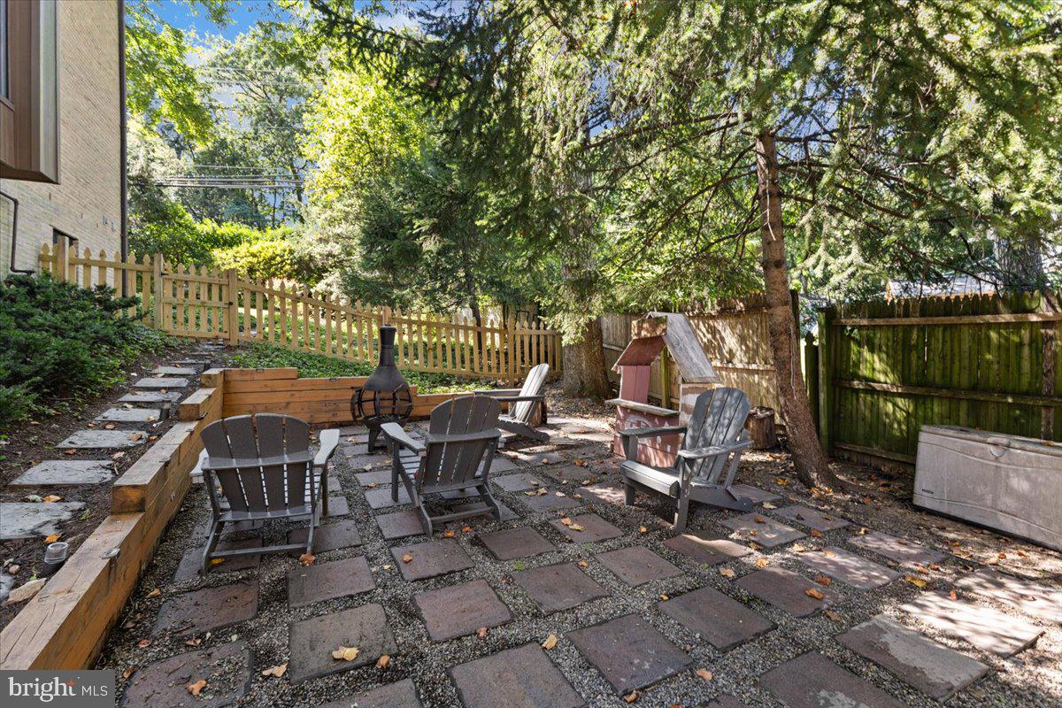 9411 Fernwood Road Bethesda, MD 20817 - Photo 75 of 101 a view of a patio with table and chairs and potted plants