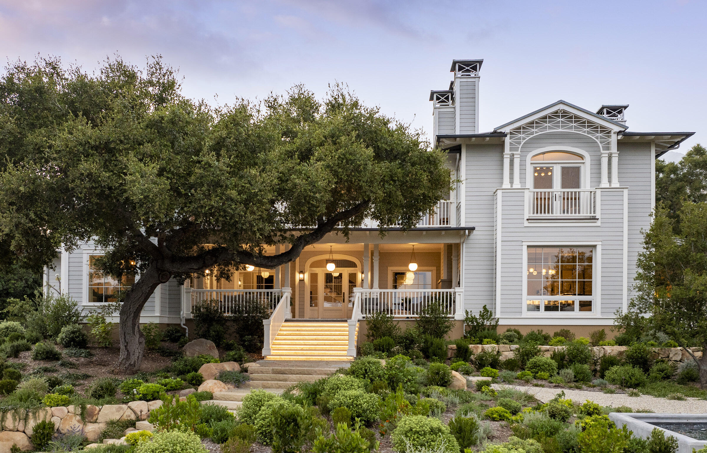 a front view of a house with garden
