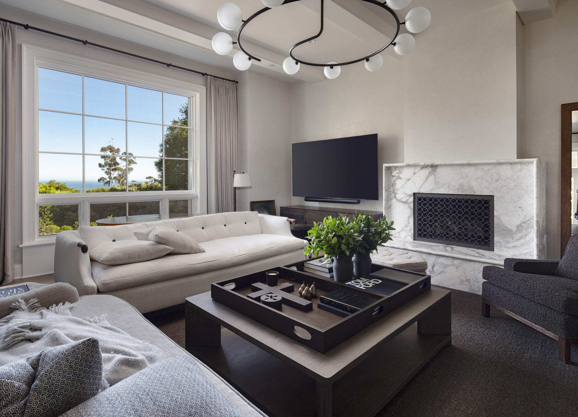 Undisclosed Address Montecito, CA 93108 - Photo 9 of 41 a living room with furniture a flat screen tv and a fireplace