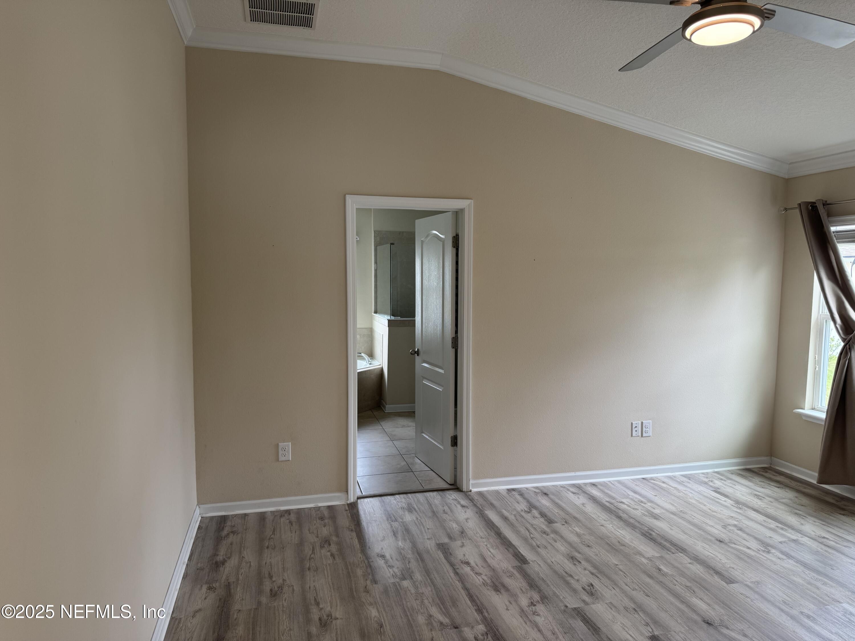 96 Midway Park Drive St. Augustine, FL 32084 - Photo 11 of 31 a view of empty room with window and wooden floor