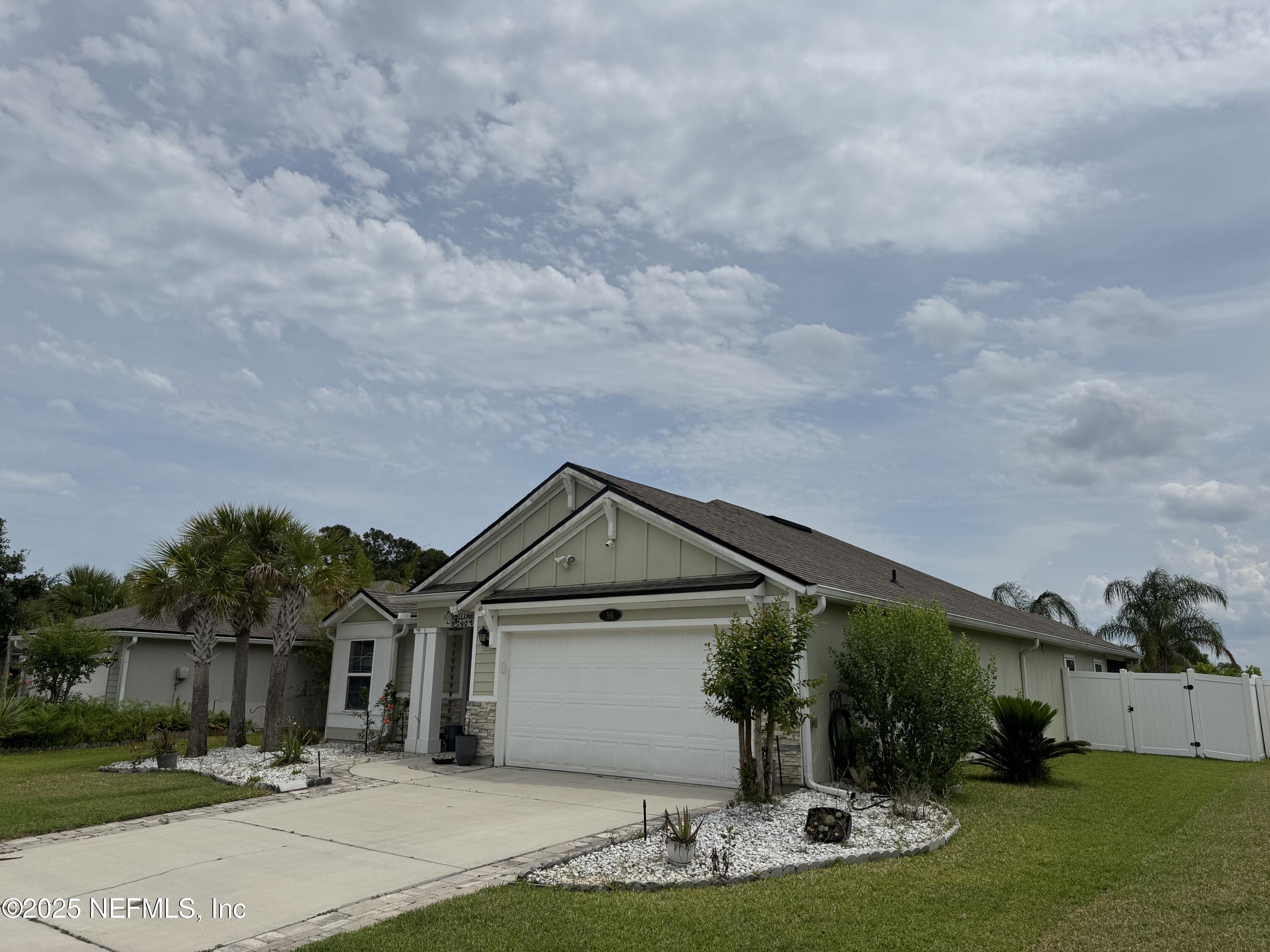 96 Midway Park Drive St. Augustine, FL 32084 - Photo 2 of 31 a front view of a house with garden
