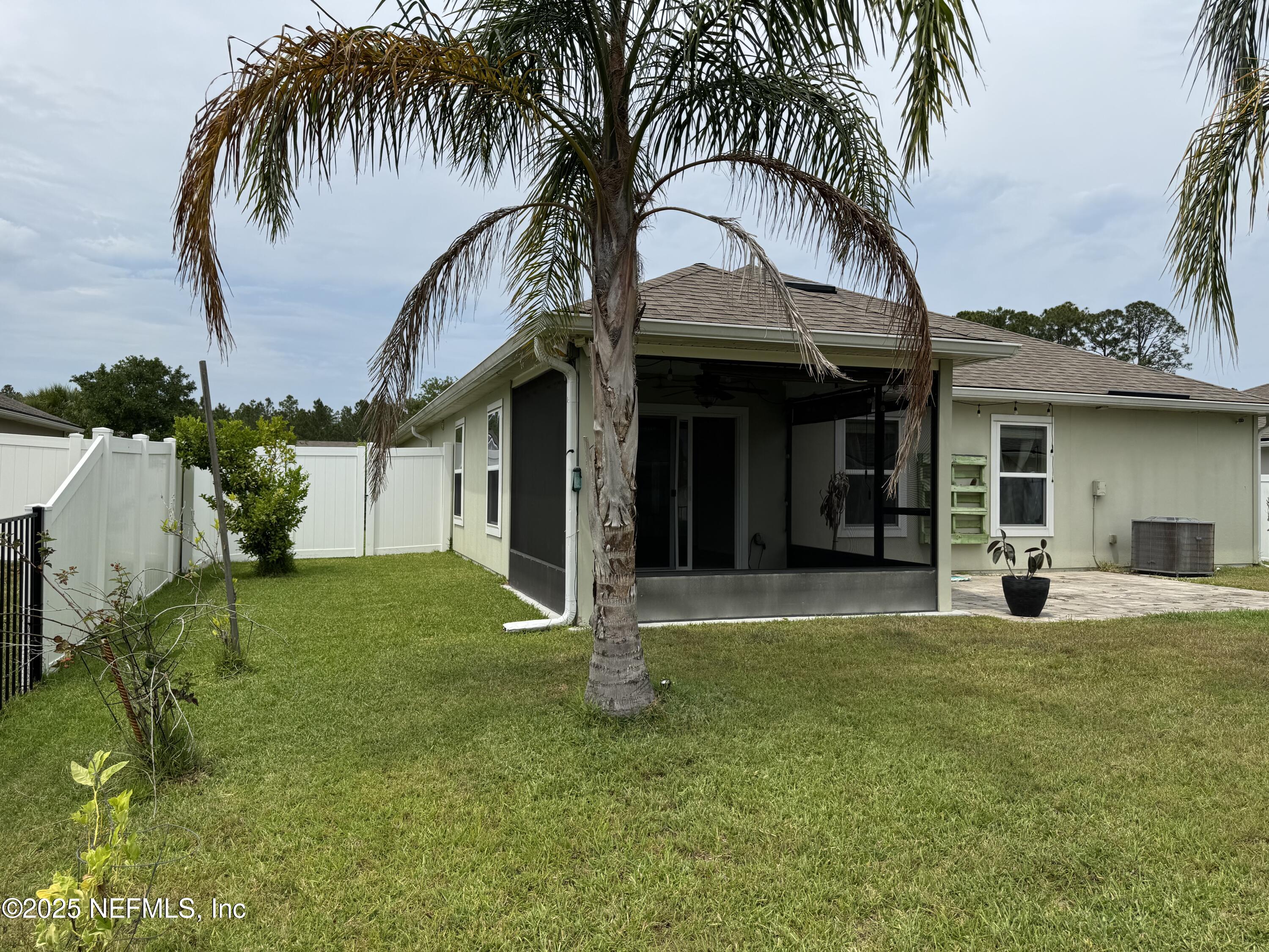 96 Midway Park Drive St. Augustine, FL 32084 - Photo 26 of 31 a view of a house with a yard and furniture