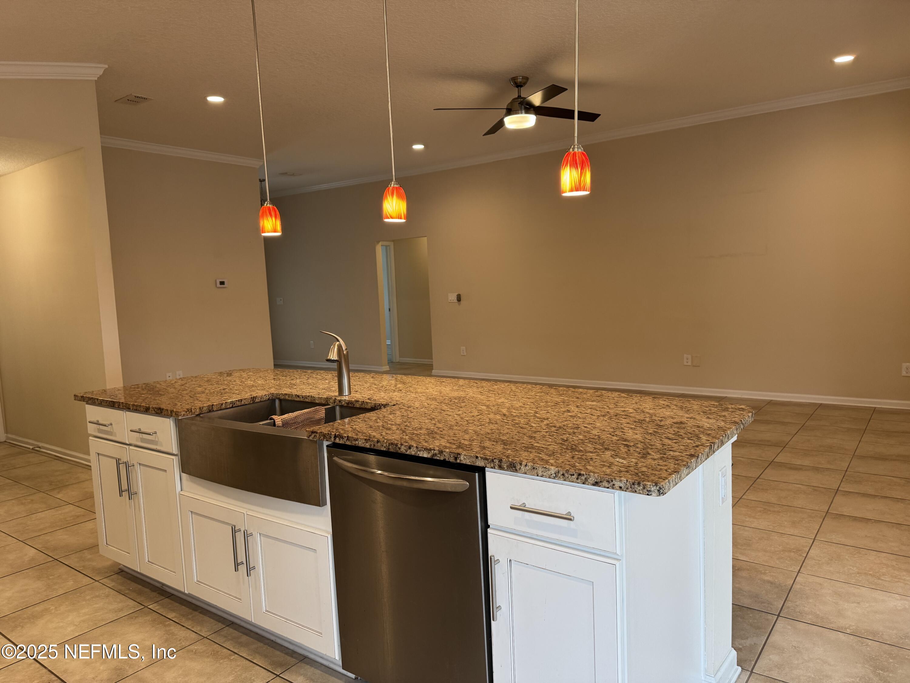 96 Midway Park Drive St. Augustine, FL 32084 - Photo 8 of 31 a kitchen with a sink and stove