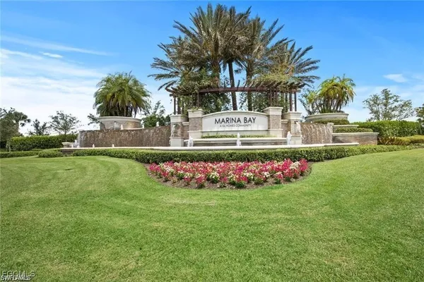a view of house with swimming pool and green space