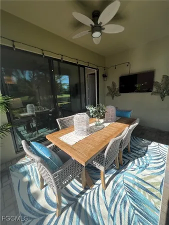 a dining room with furniture and window