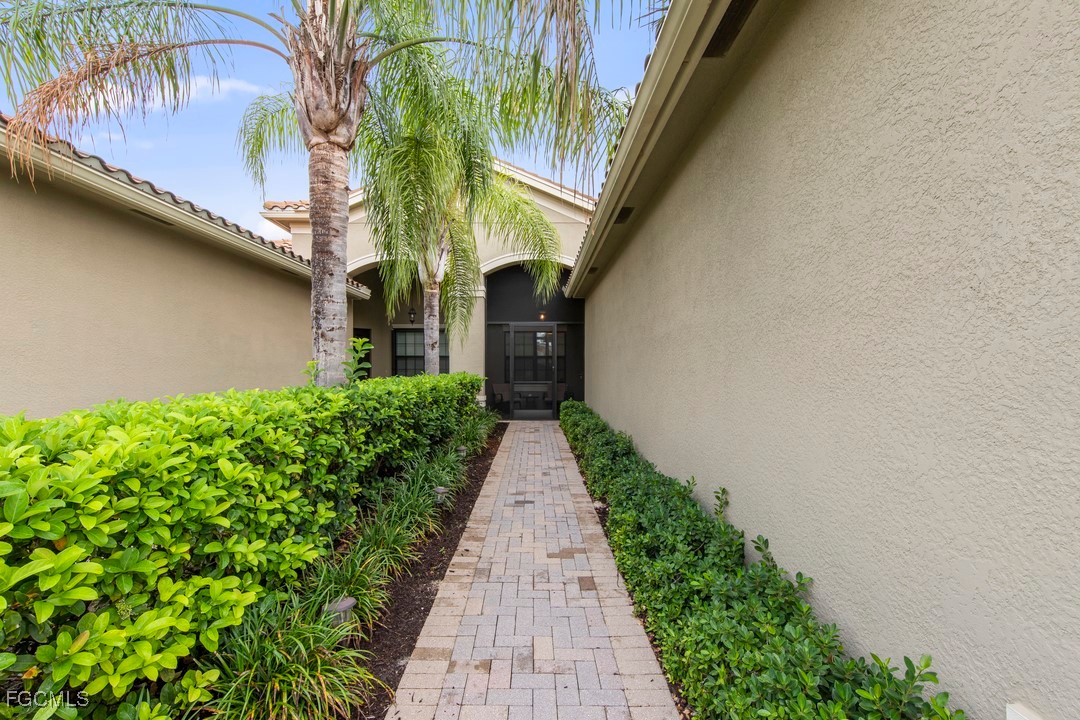 12016 Five Waters Circle Fort Myers, FL 33913 - Photo 10 of 19 a view of a pathway with a flower plants