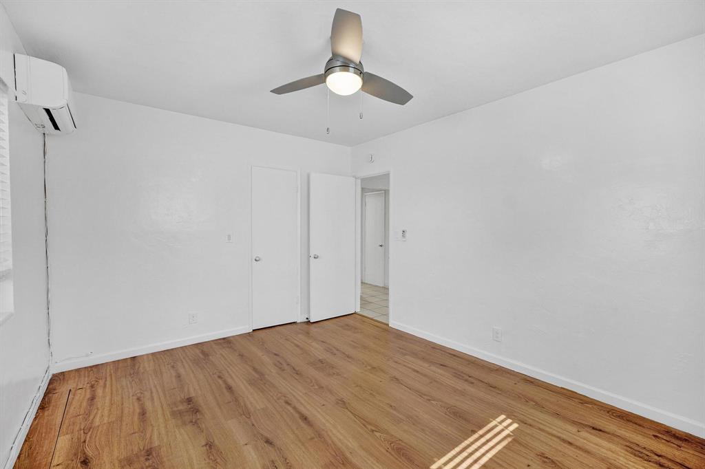 326 Madison Street, Unit 2 Hollywood, FL 33019 - Photo 16 of 27 a view of empty room with wooden floor and ceiling fan