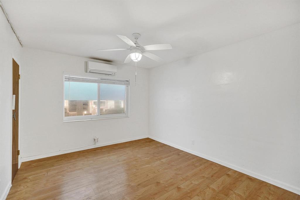 326 Madison Street, Unit 2 Hollywood, FL 33019 - Photo 17 of 27 an empty room with windows and fan