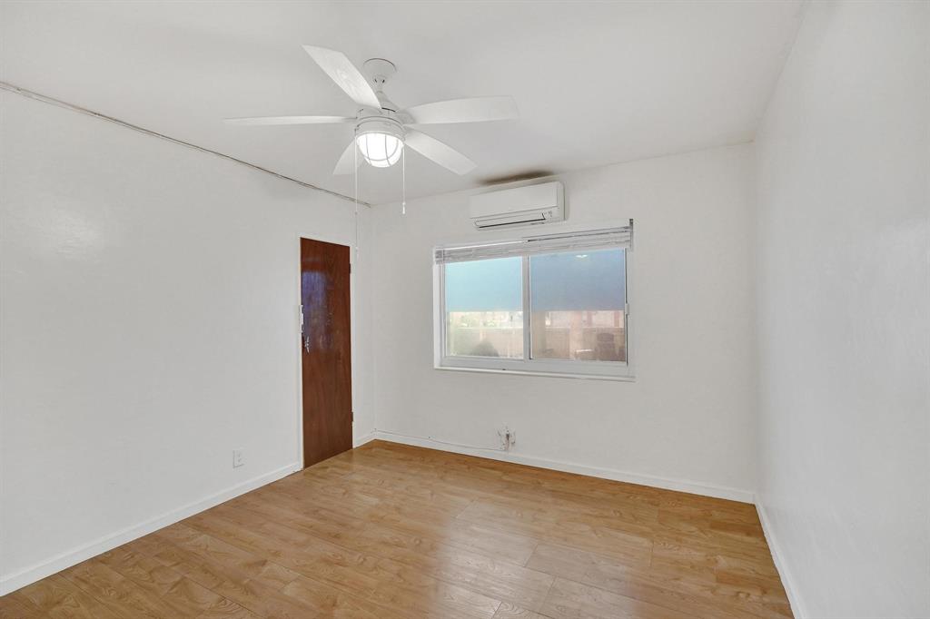 326 Madison Street, Unit 2 Hollywood, FL 33019 - Photo 18 of 27 an empty room with a ceiling fan and a window