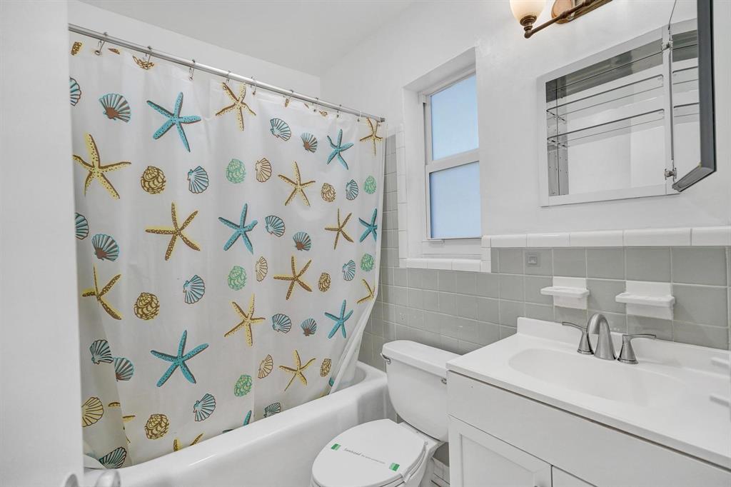 326 Madison Street, Unit 2 Hollywood, FL 33019 - Photo 20 of 27 a bathroom with a sink toilet and shower