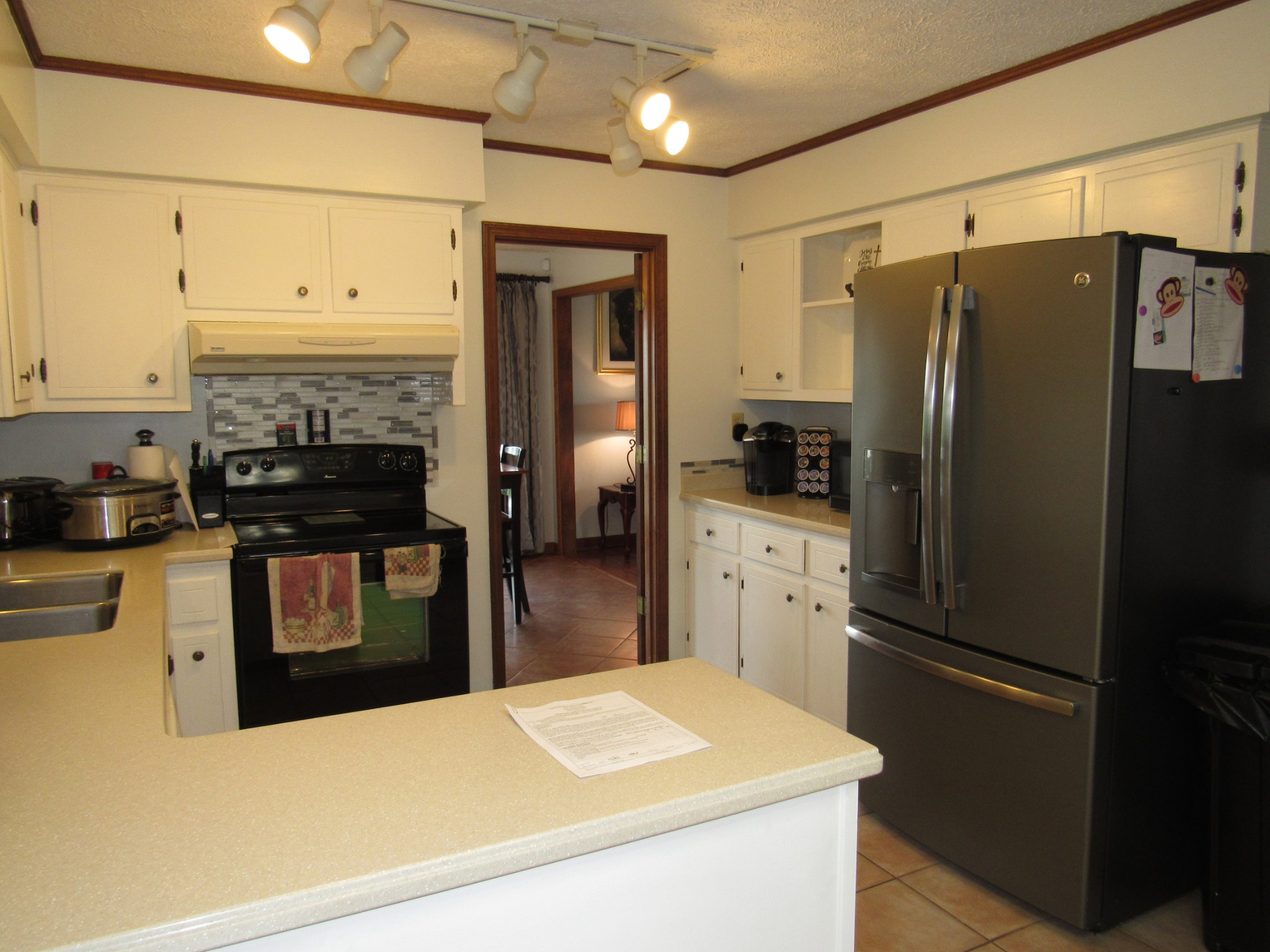11885 Palmyra Road Oak Grove, KY 42262 - Photo 7 of 21 a kitchen with a refrigerator and a stove