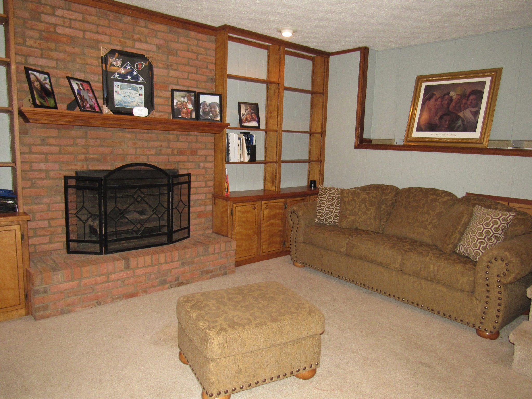 11885 Palmyra Road Oak Grove, KY 42262 - Photo 10 of 21 a living room with furniture a fireplace and a wall painting