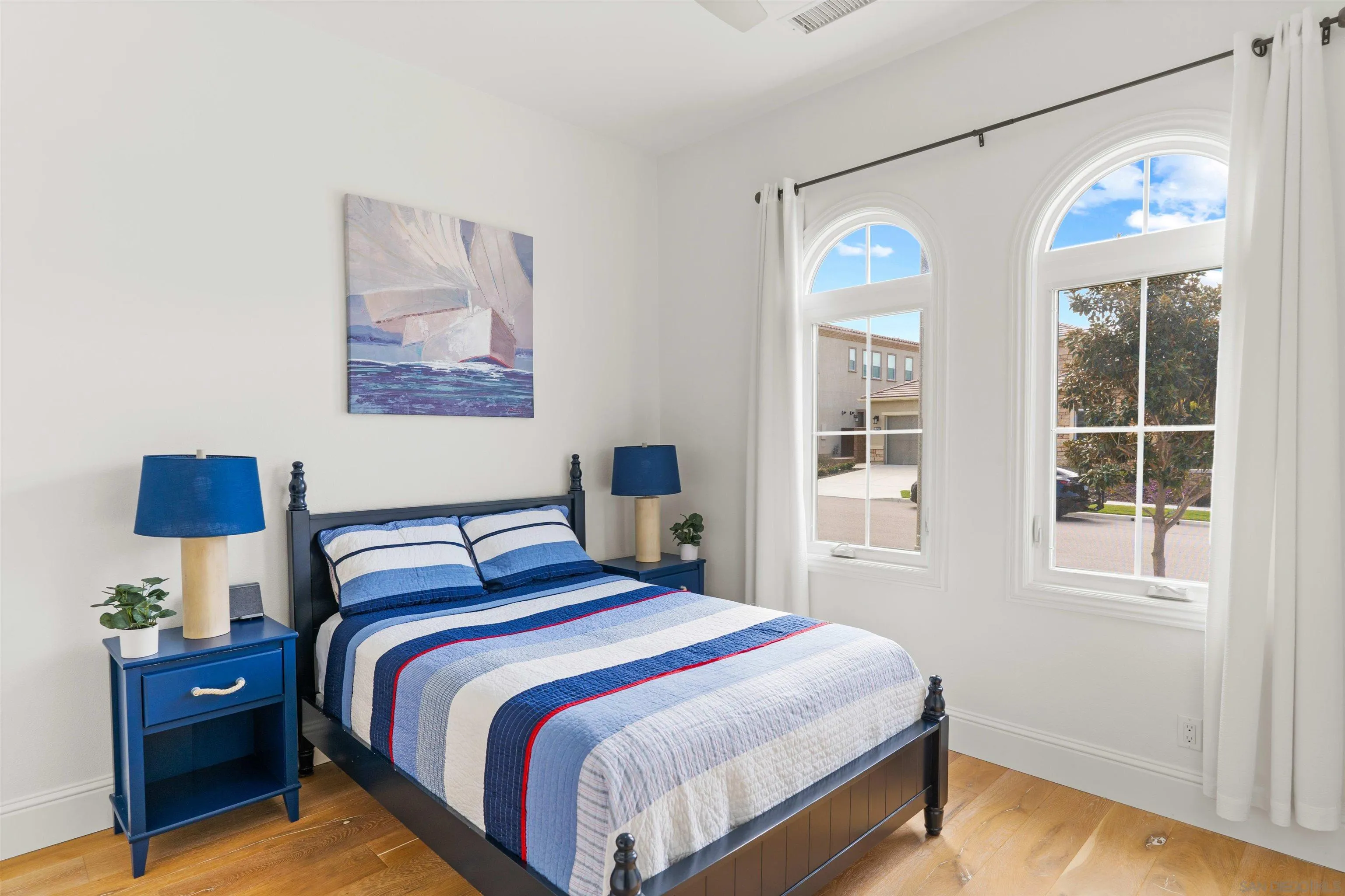 2520 Wellspring Street Carlsbad, CA 92010 - Photo 13 of 26 a bedroom with bed and wooden floor