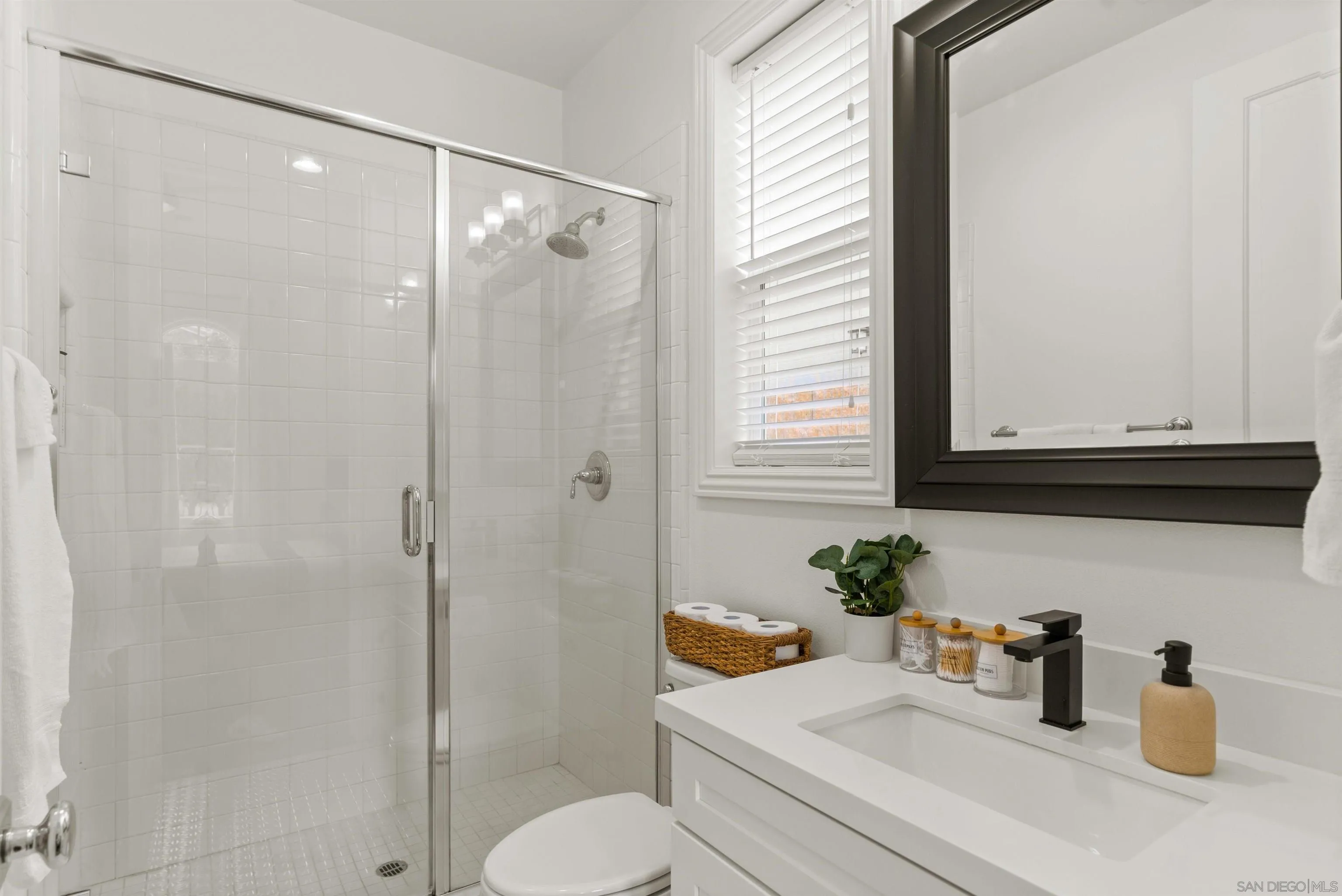 2520 Wellspring Street Carlsbad, CA 92010 - Photo 14 of 26 a bathroom with a sink a toilet and shower