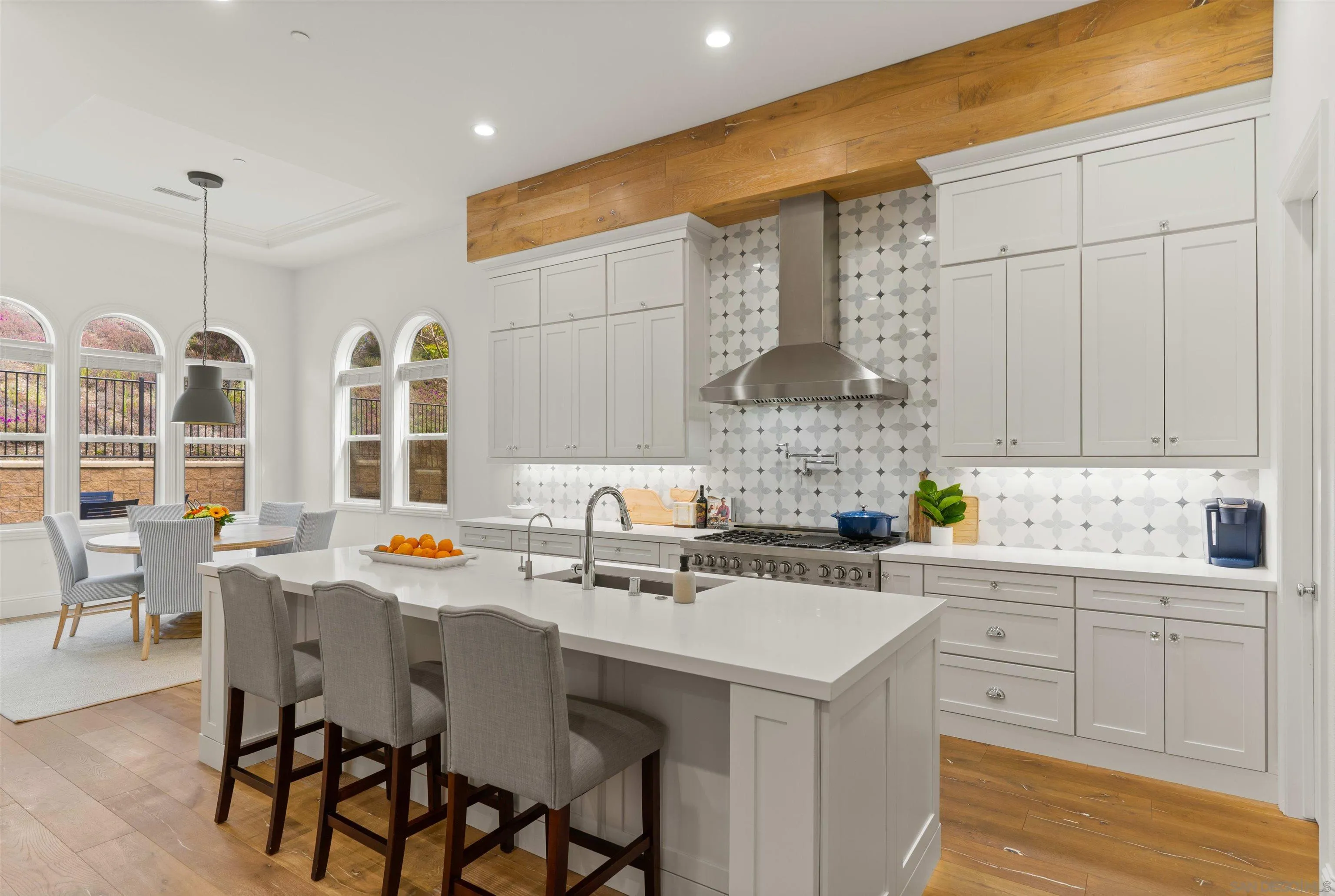 2520 Wellspring Street Carlsbad, CA 92010 - Photo 2 of 26 a kitchen with a sink stove and cabinets