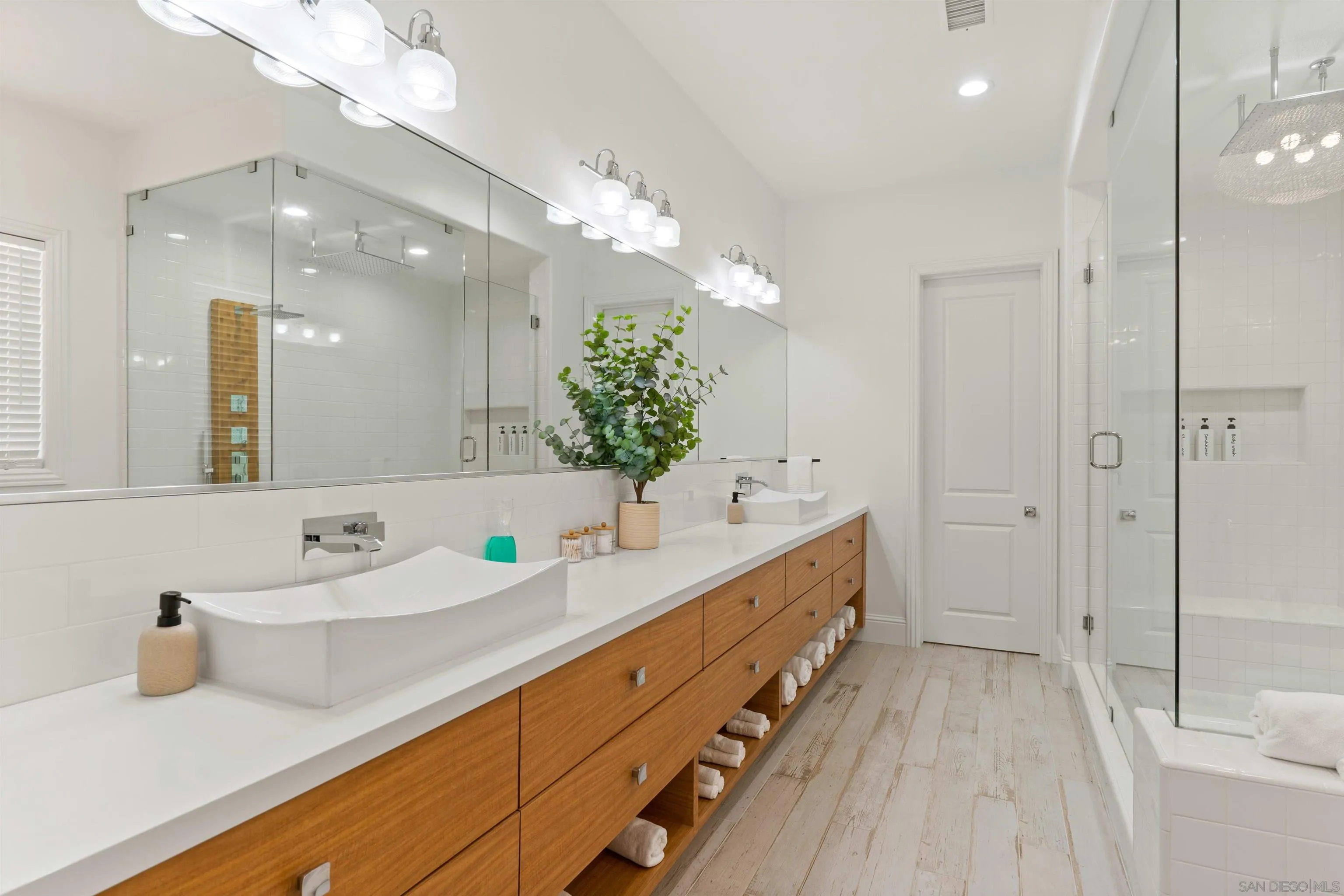2520 Wellspring Street Carlsbad, CA 92010 - Photo 4 of 26 a bathroom with a double vanity sink mirror and shower