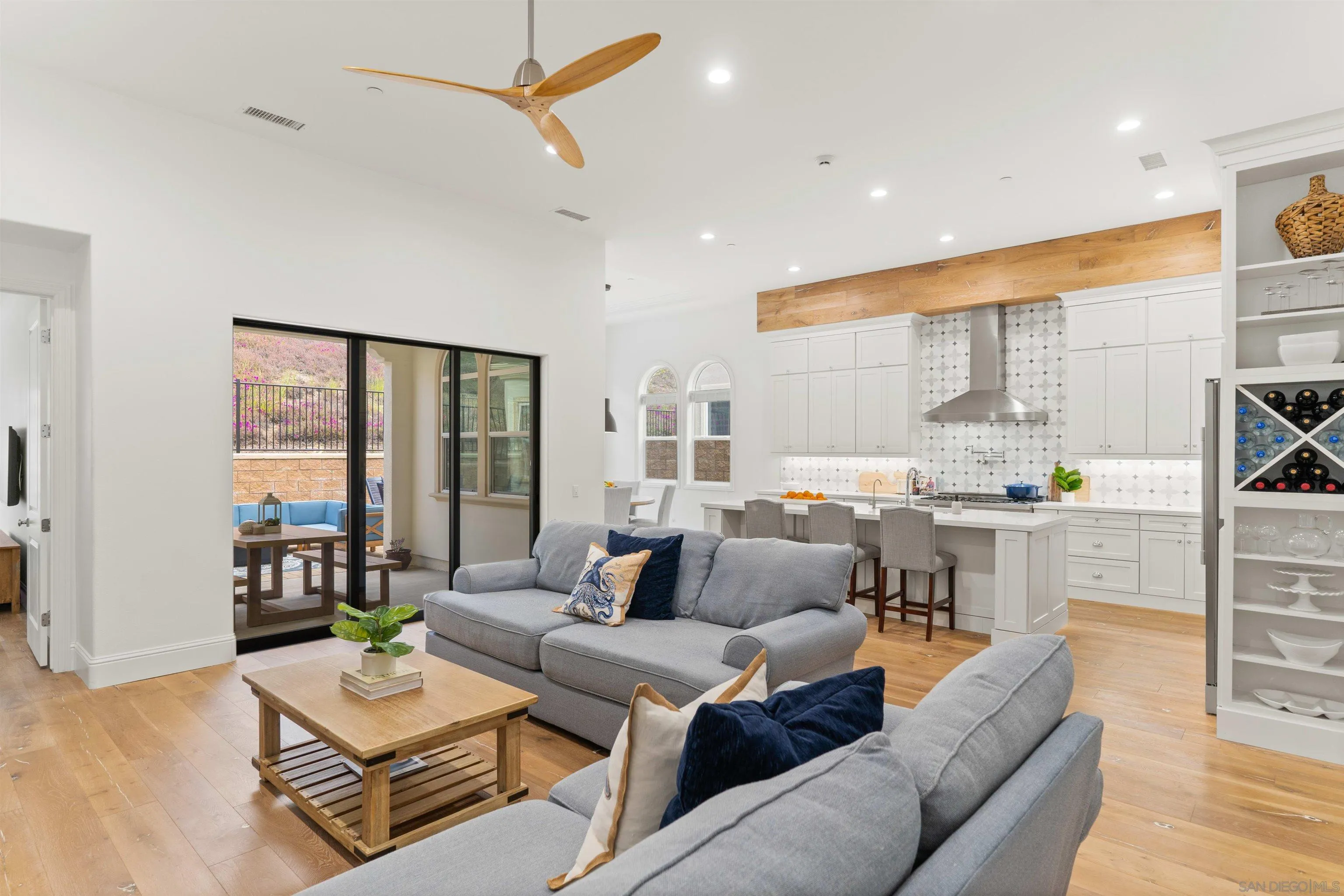 2520 Wellspring Street Carlsbad, CA 92010 - Photo 7 of 26 a living room with furniture kitchen view and a large window