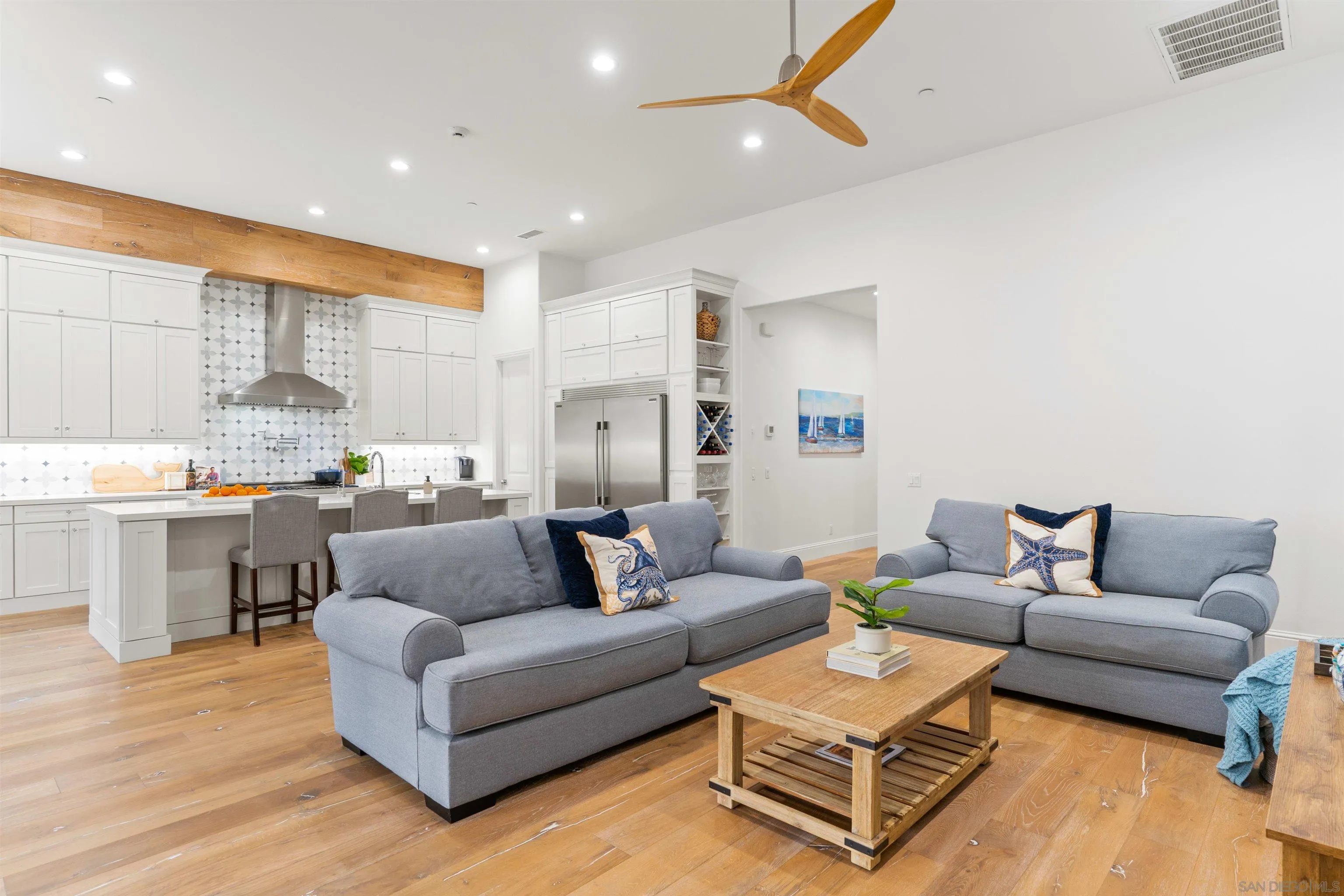2520 Wellspring Street Carlsbad, CA 92010 - Photo 8 of 26 a living room with furniture kitchen and a table