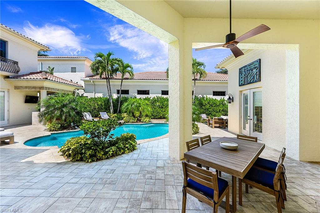9155 Torrefino Court Naples, FL 34109 - Photo 26 of 28 Covered Outdoor Dining