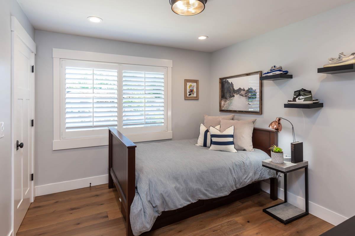 1489 Brookmill Road Los Altos, CA 94024 - Photo 20 of 43 a bedroom with a bed and a table in it