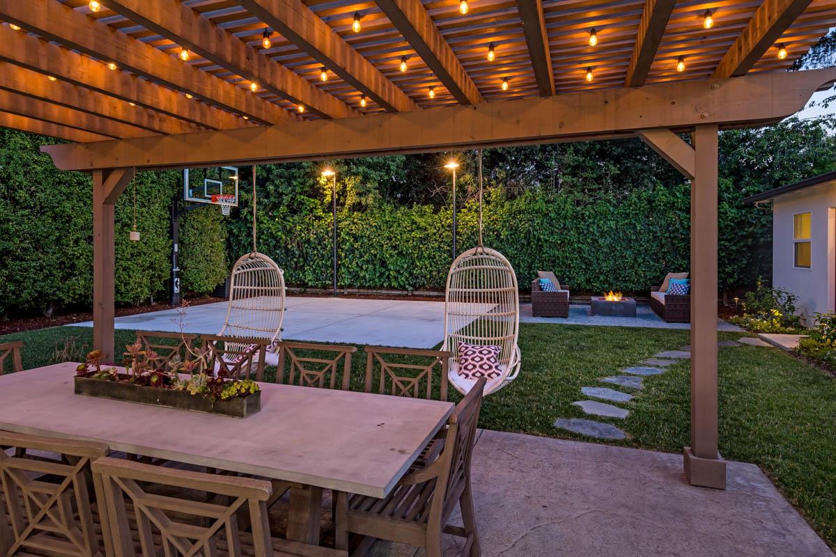 1489 Brookmill Road Los Altos, CA 94024 - Photo 25 of 43 a view of a patio with a table chairs and a backyard