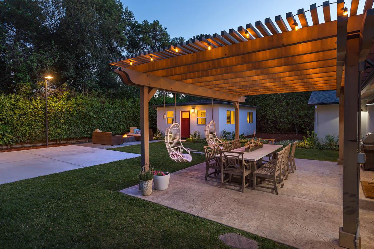 1489 Brookmill Road Los Altos, CA 94024 - Photo 28 of 43 a view of a patio with table and chairs potted plants and large tree
