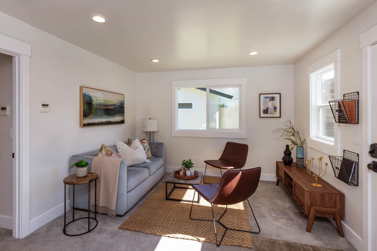 1489 Brookmill Road Los Altos, CA 94024 - Photo 36 of 43 a living room with furniture a flat screen tv and a window