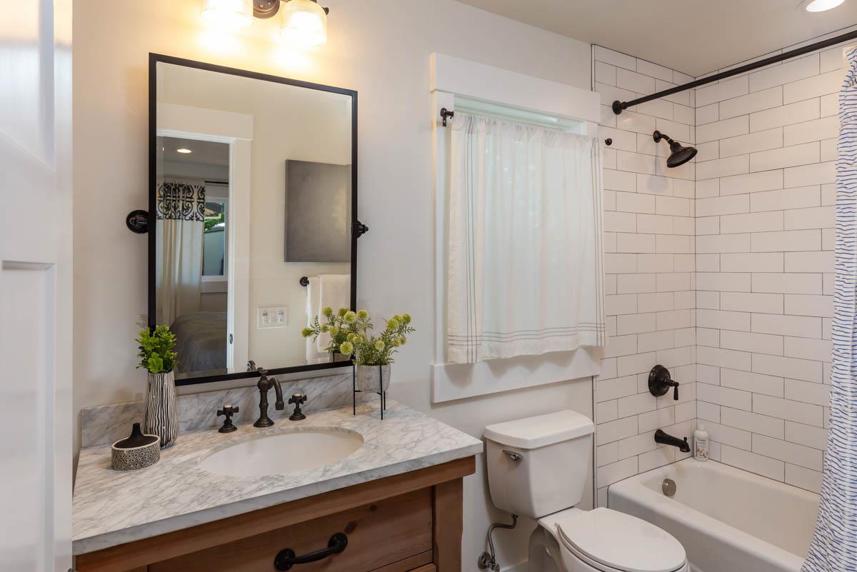 1489 Brookmill Road Los Altos, CA 94024 - Photo 40 of 43 a bathroom with a granite countertop sink toilet and shower