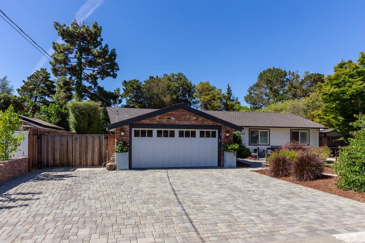 1489 Brookmill Road Los Altos, CA 94024 - Photo 4 of 43 a front view of a house with a garden and pathway