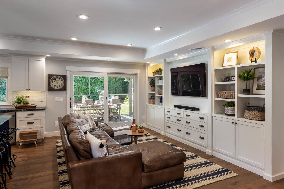 1489 Brookmill Road Los Altos, CA 94024 - Photo 9 of 43 a living room with furniture a flat screen tv and large window