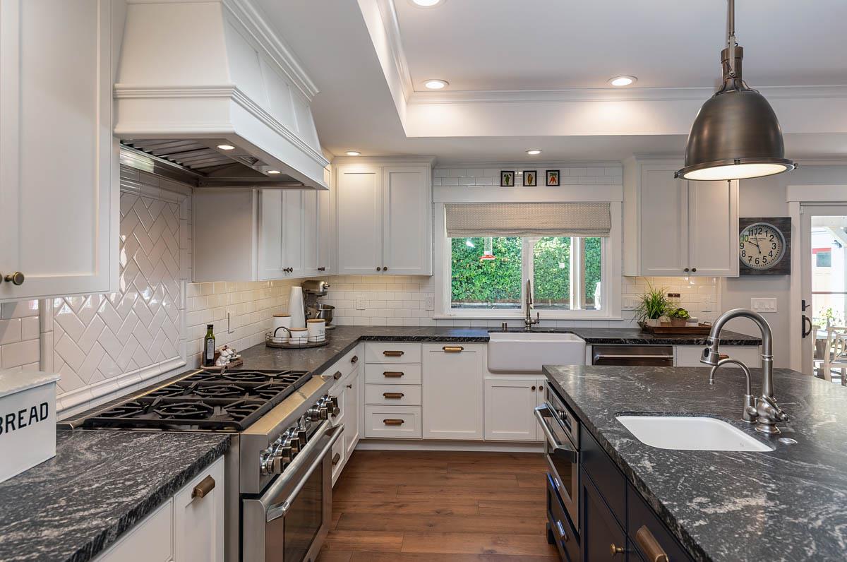 1489 Brookmill Road Los Altos, CA 94024 - Photo 10 of 43 a kitchen with granite countertop a sink stove and cabinets