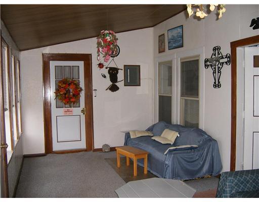 81 Main Street Stratton, ME 04982 - Photo 6 of 13 Den/Family/Great Room. Sunny porch...