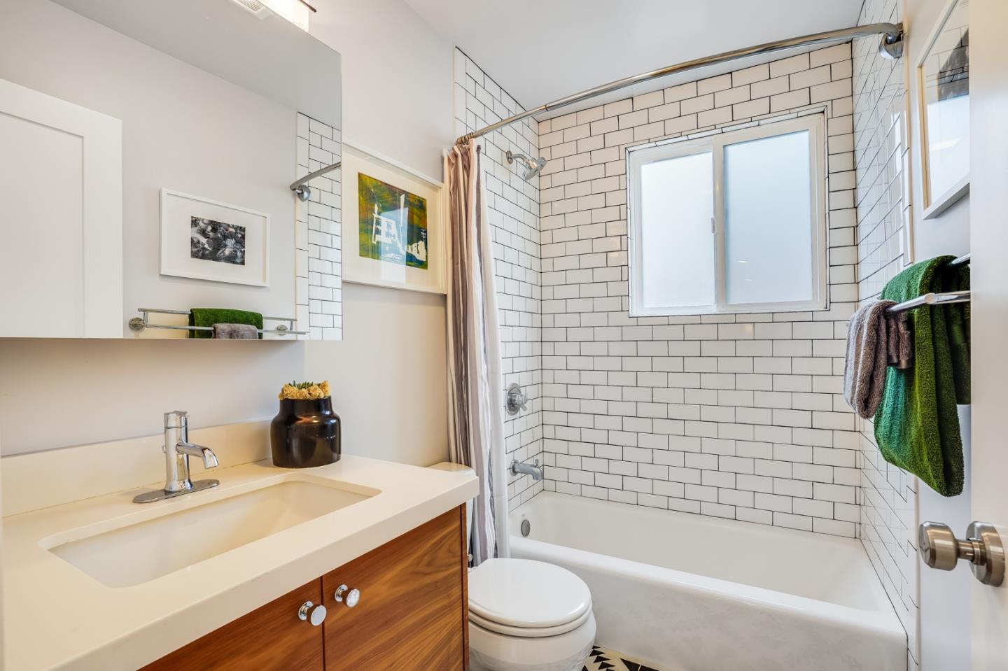 646 Brighton Road Pacifica, CA 94044 - Photo 12 of 26 a bathroom with a sink toilet and shower