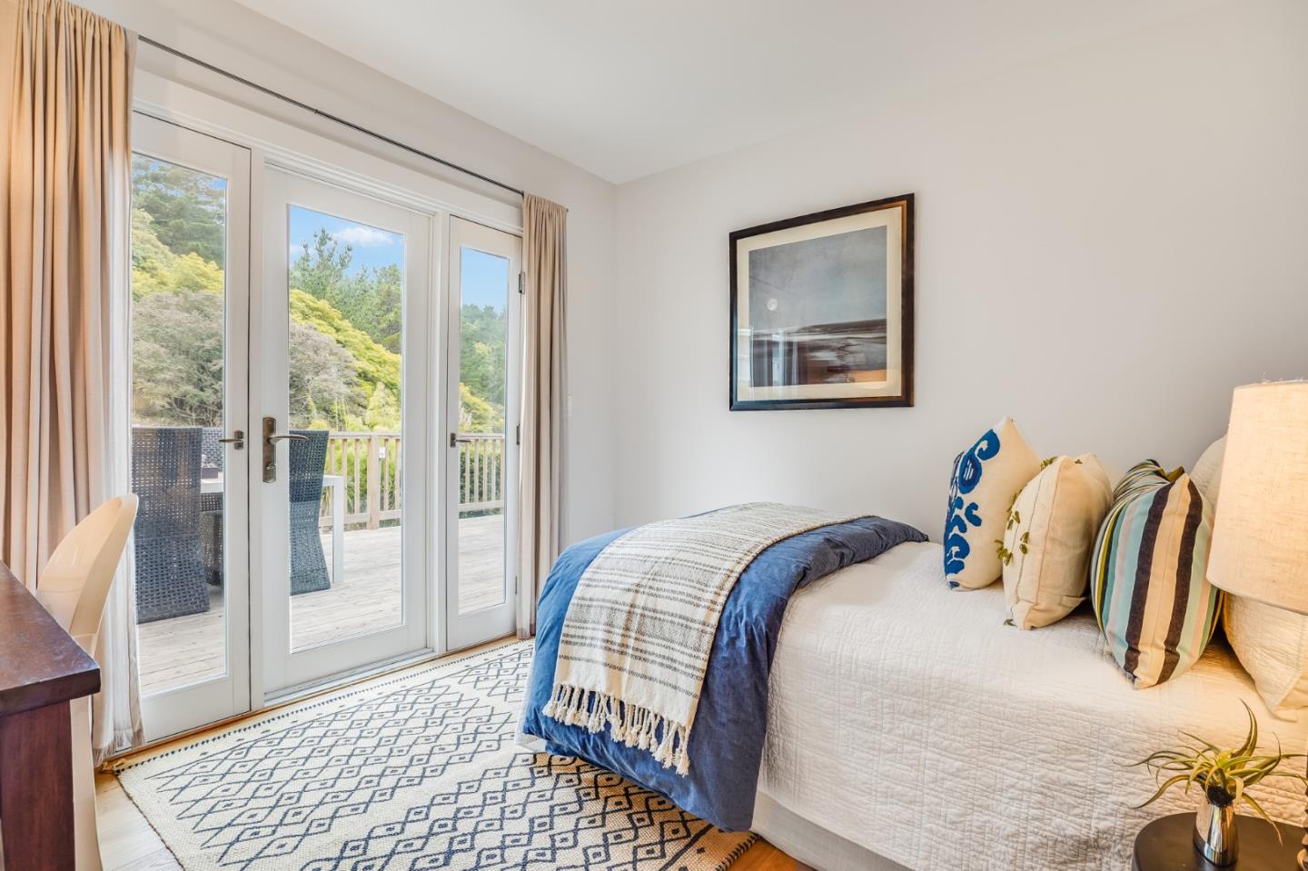 646 Brighton Road Pacifica, CA 94044 - Photo 13 of 26 a bedroom with a bed and wooden floor