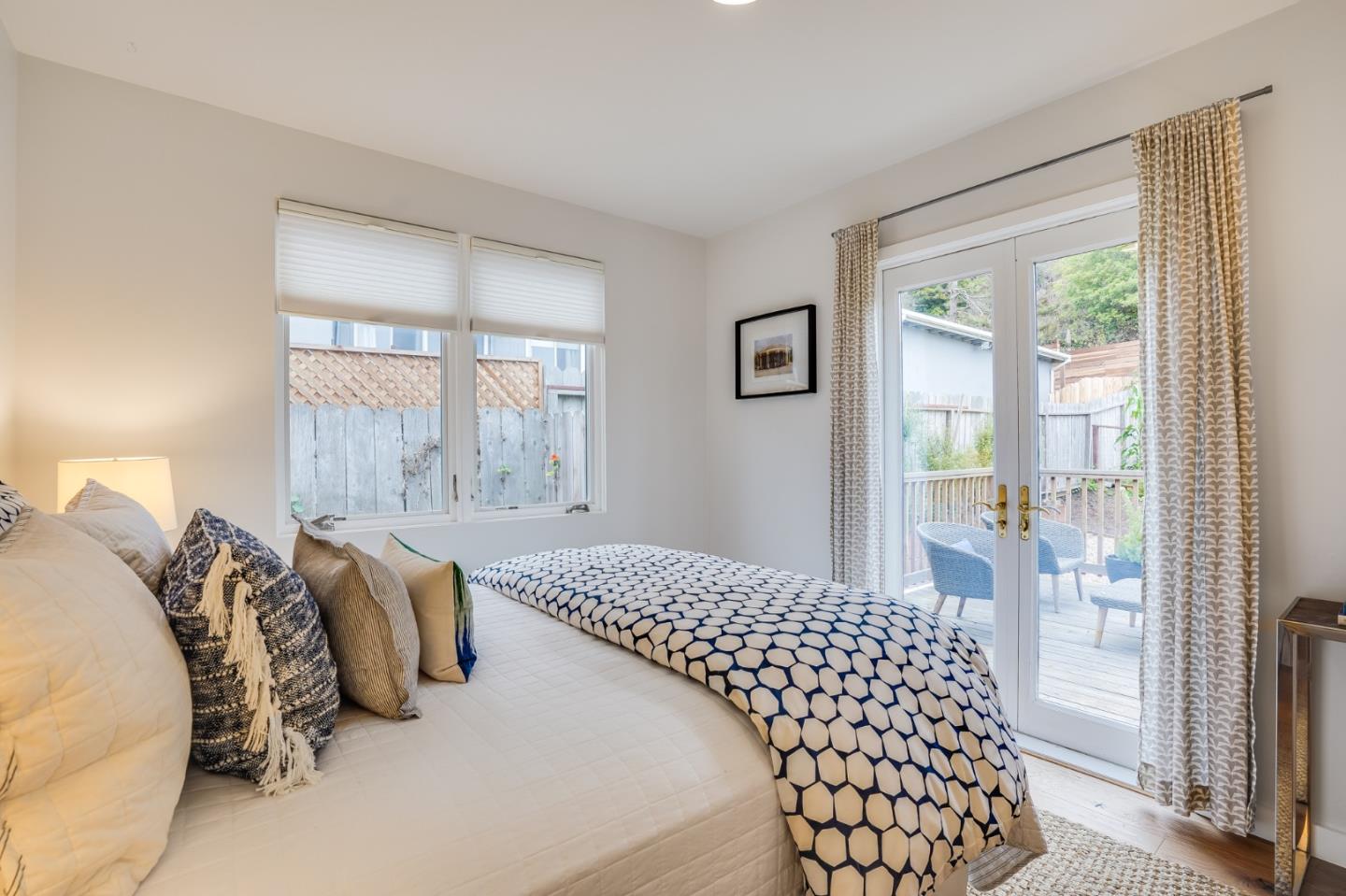 646 Brighton Road Pacifica, CA 94044 - Photo 15 of 26 a bedroom with a bed and a window