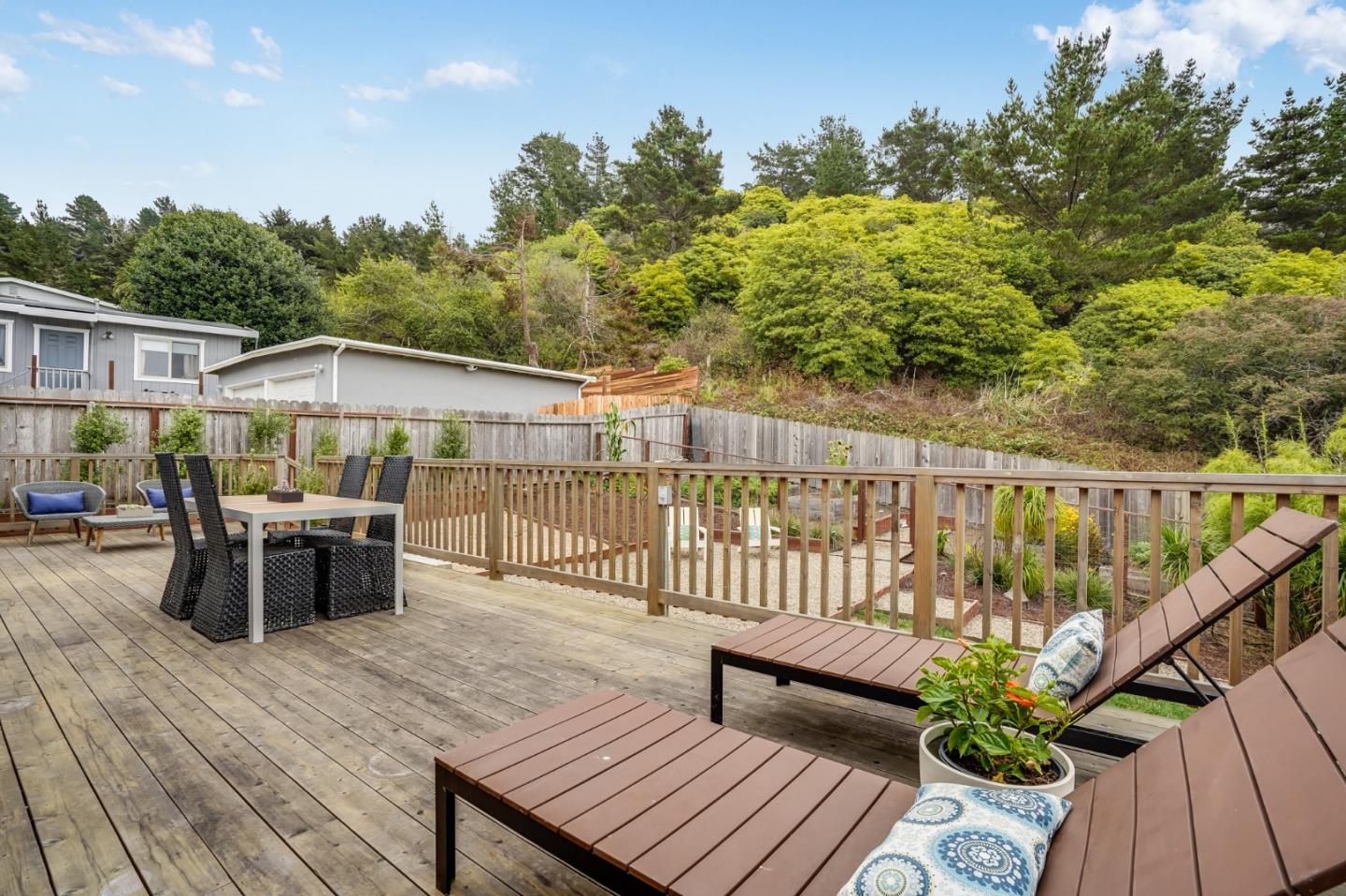 646 Brighton Road Pacifica, CA 94044 - Photo 18 of 26 a balcony with wooden floor table and chairs