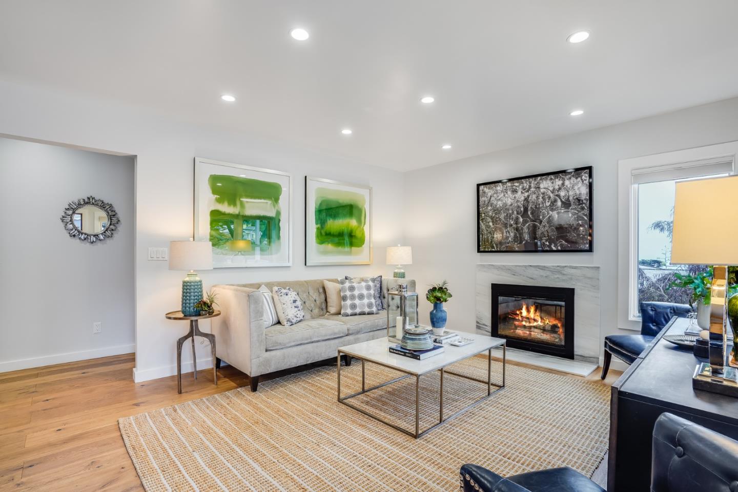 646 Brighton Road Pacifica, CA 94044 - Photo 2 of 26 a living room with furniture and a fireplace