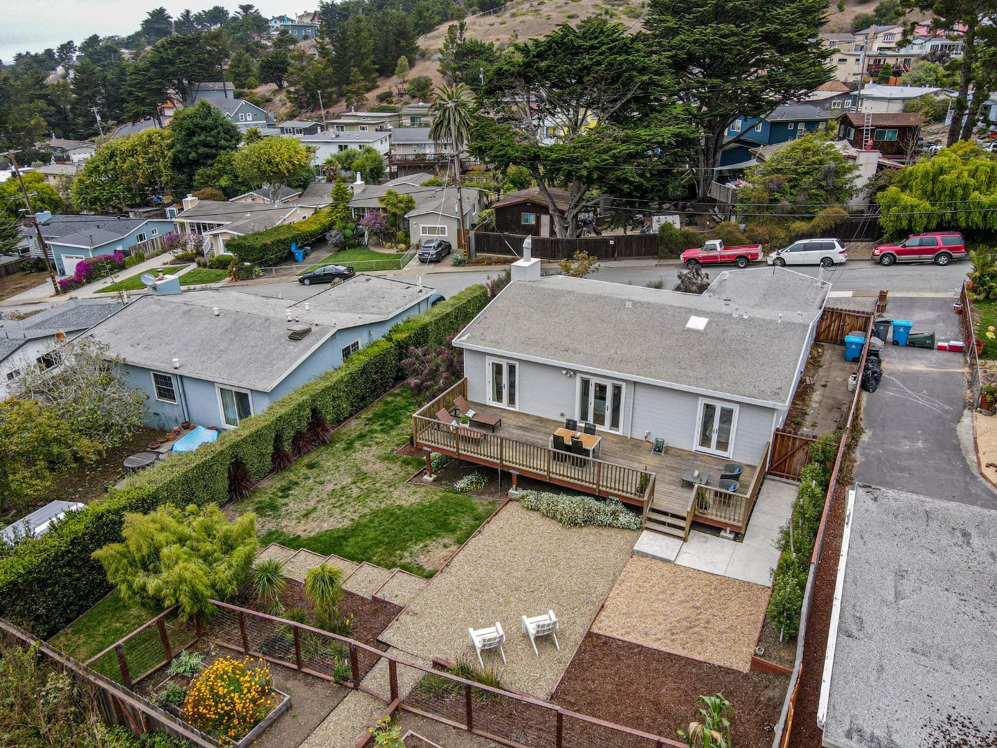 646 Brighton Road Pacifica, CA 94044 - Photo 23 of 26 an aerial view of a house with swimming pool and a yard