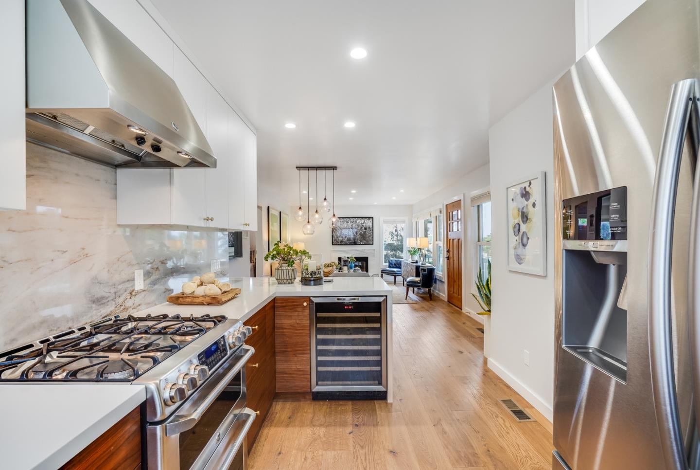 646 Brighton Road Pacifica, CA 94044 - Photo 9 of 26 a kitchen with stainless steel appliances granite countertop a stove and a refrigerator