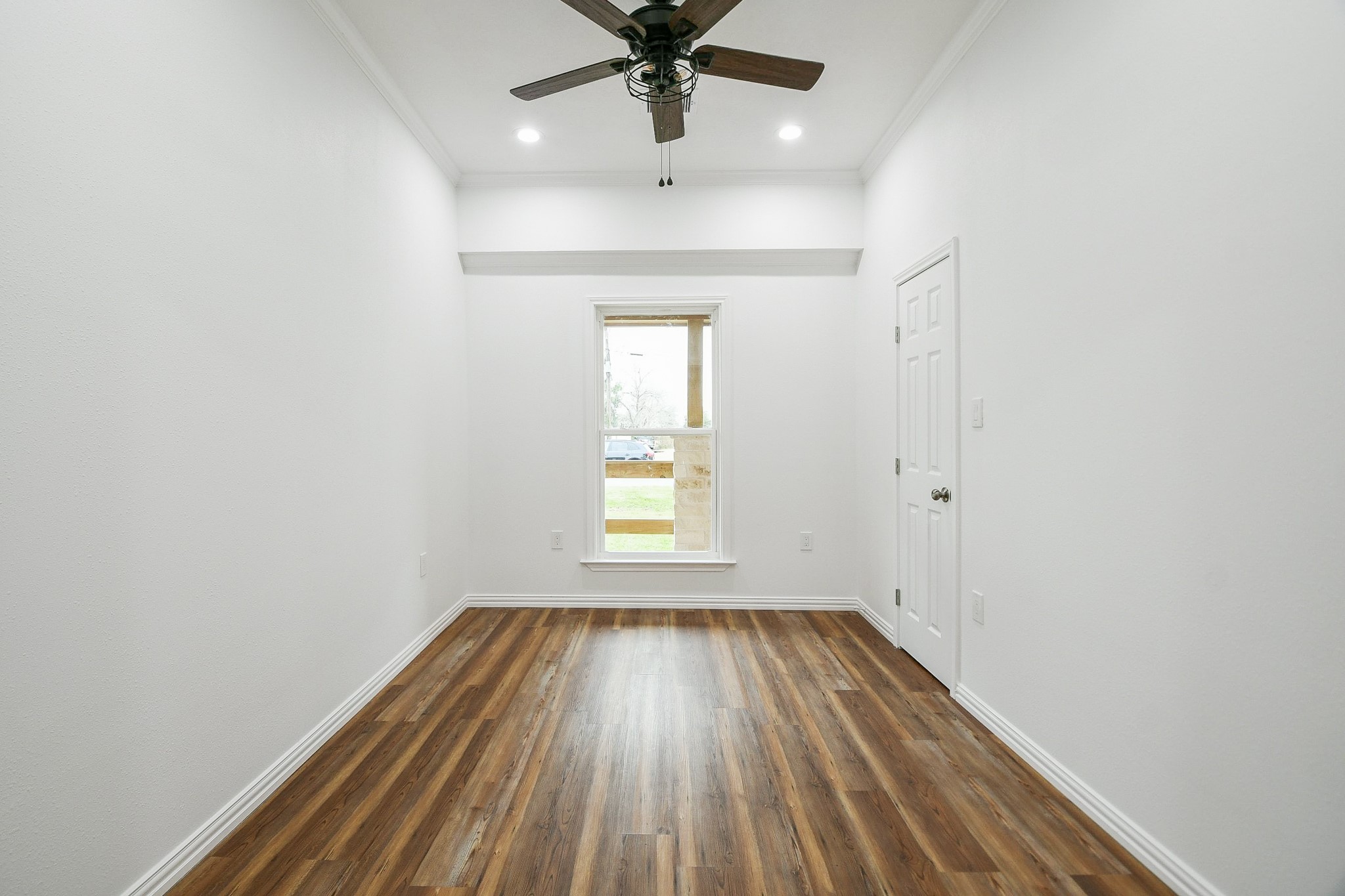 3200 Hoover Street La Marque, TX 77568 - Photo 12 of 31 wooden floor in an empty room with a window
