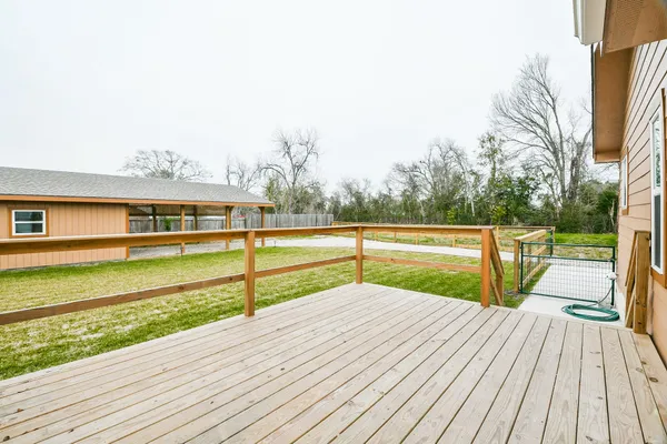a view of balcony with deck and wooden floor