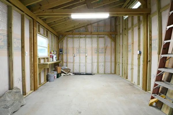 a view of a house with a yard and a fountain