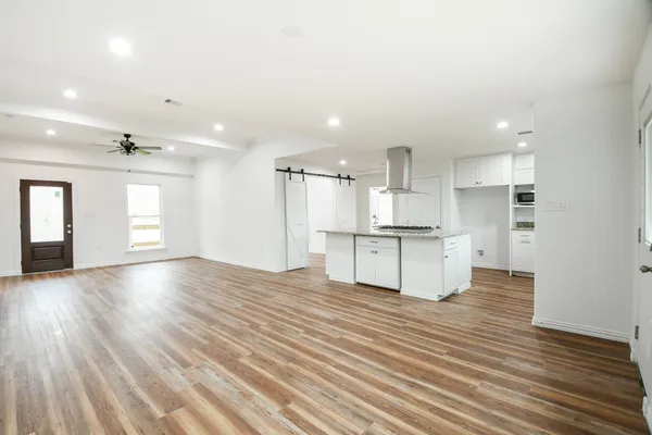a view of kitchen cabinet and refrigerator