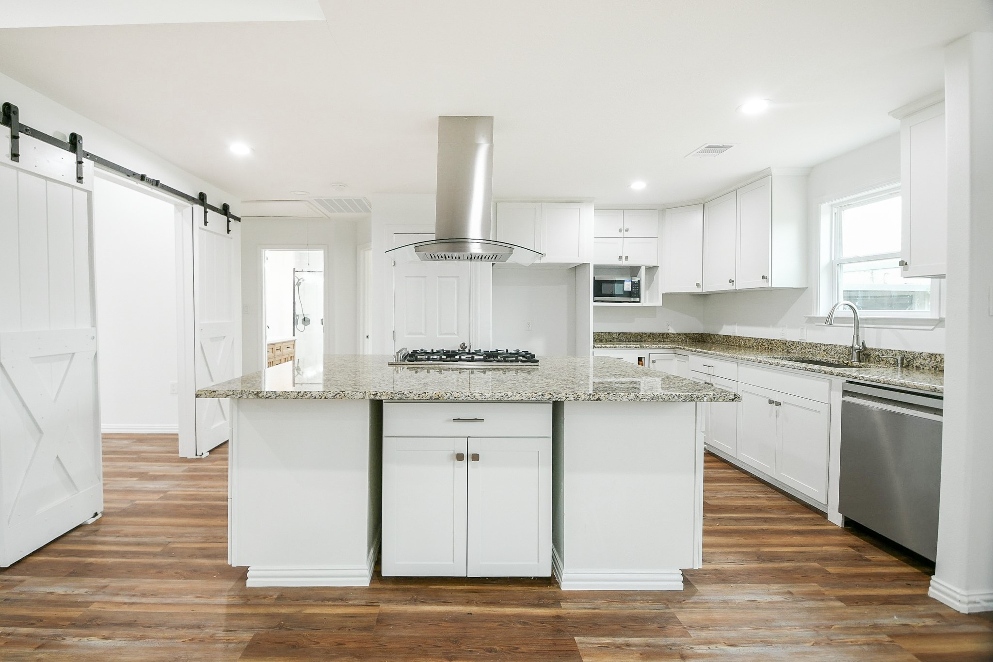 3200 Hoover Street La Marque, TX 77568 - Photo 7 of 31 a kitchen with granite countertop white cabinets and white appliances